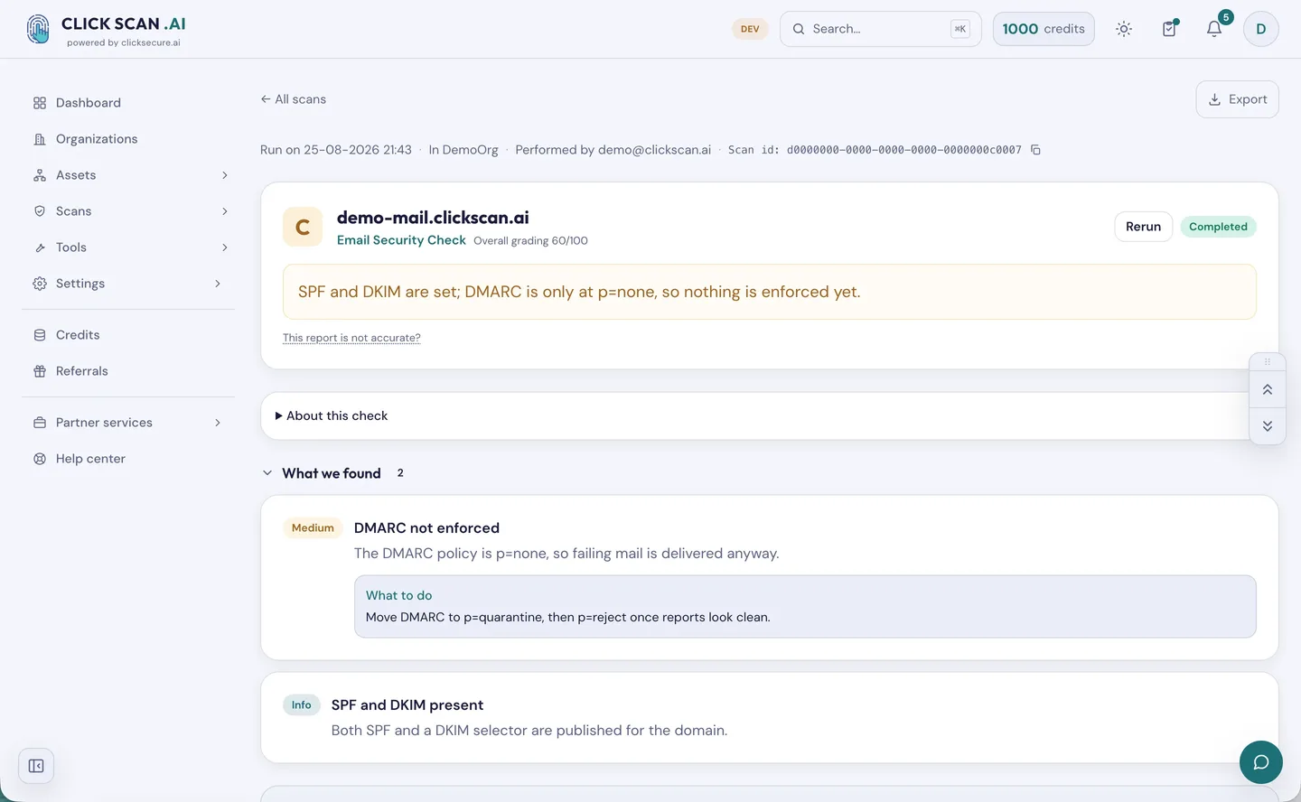 An email security report graded C: SPF and DKIM are present, but DMARC is flagged at Medium because the policy is still set to none, with the next step spelled out.